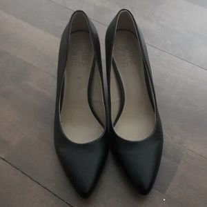 Black leather pumps